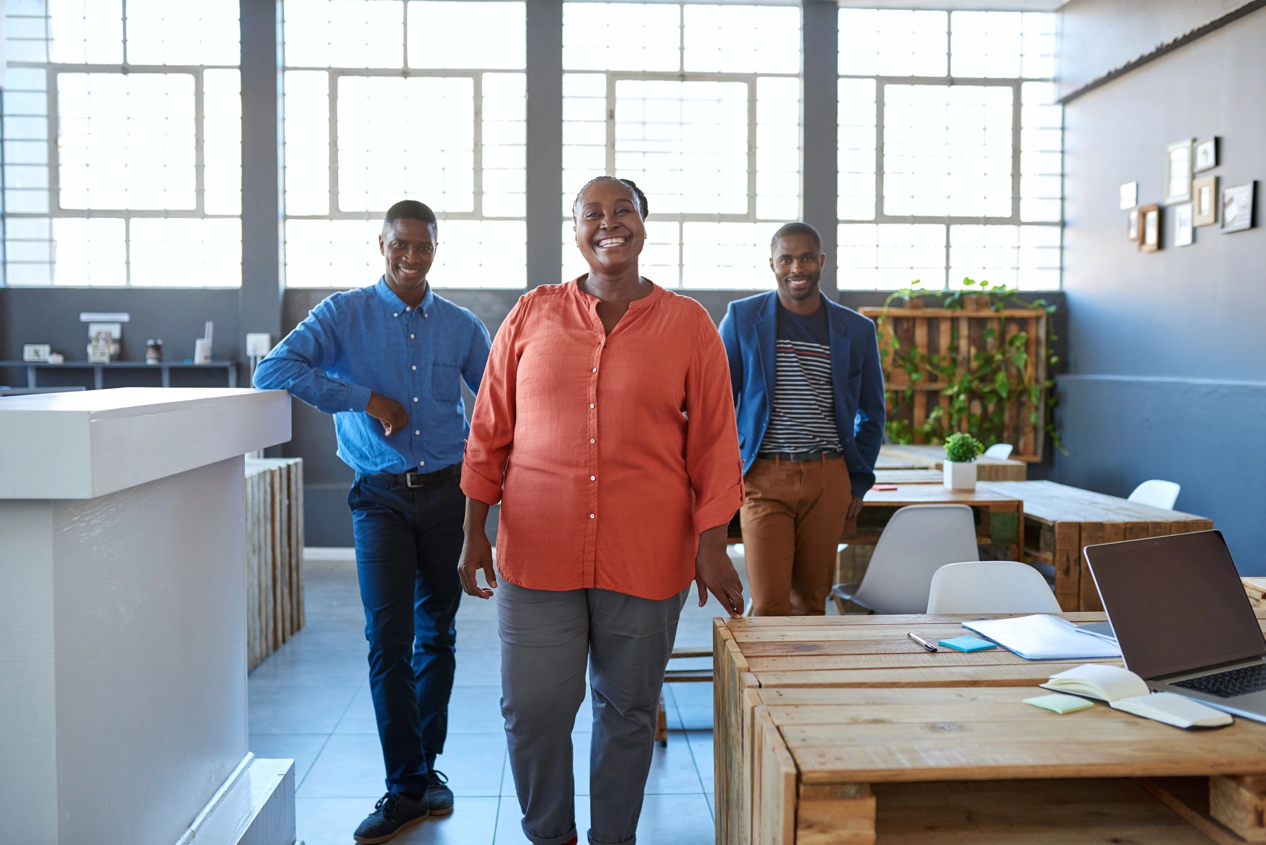 Professional team standing together in office
